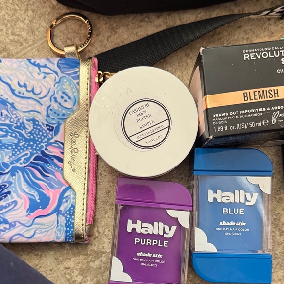 Black Crossbody Bag with Butterfly Accent and beauty items - Picture 3 of 4